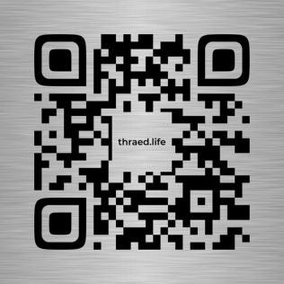 QR code with 'thraed.life' text on a metallic background